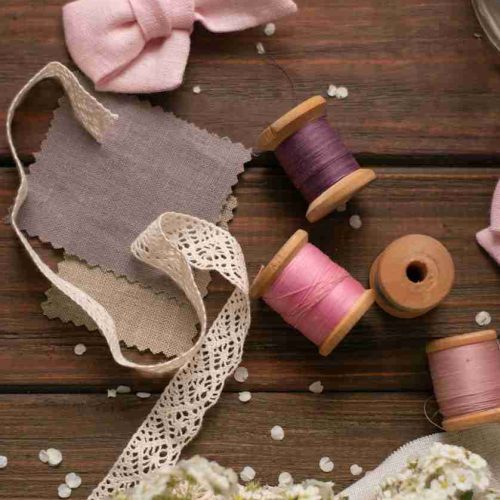 four assorted-color yarn thread spools